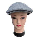 Boina con visera de tela liso paño .